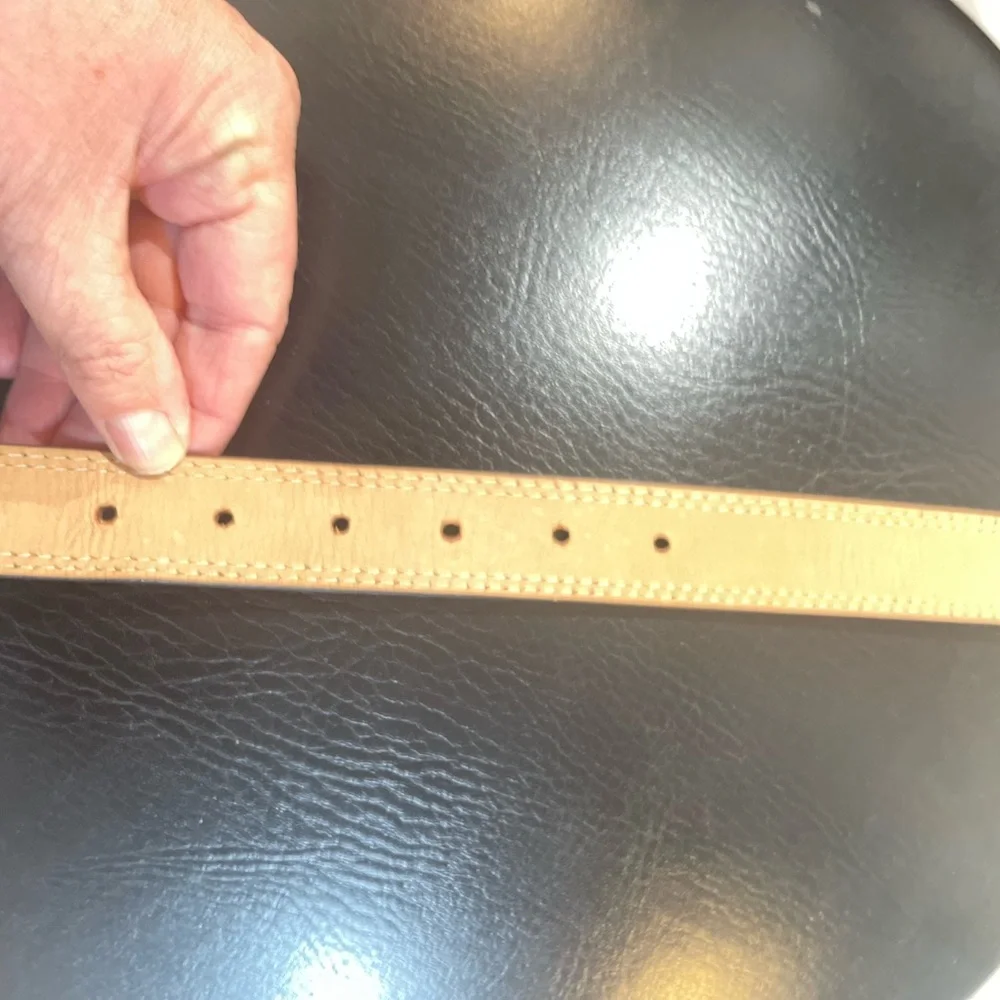NWOT Genuine leather belt. 31” of leather end to end not including buckle.26/28